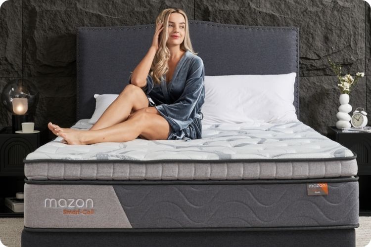 Woman sitting on a bare mattress